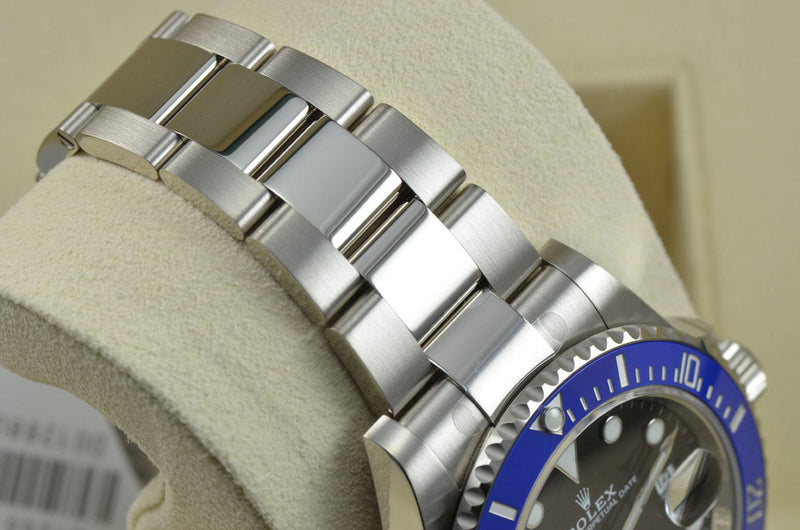 Luxury Watch Submariner Blue Bezel Black Background